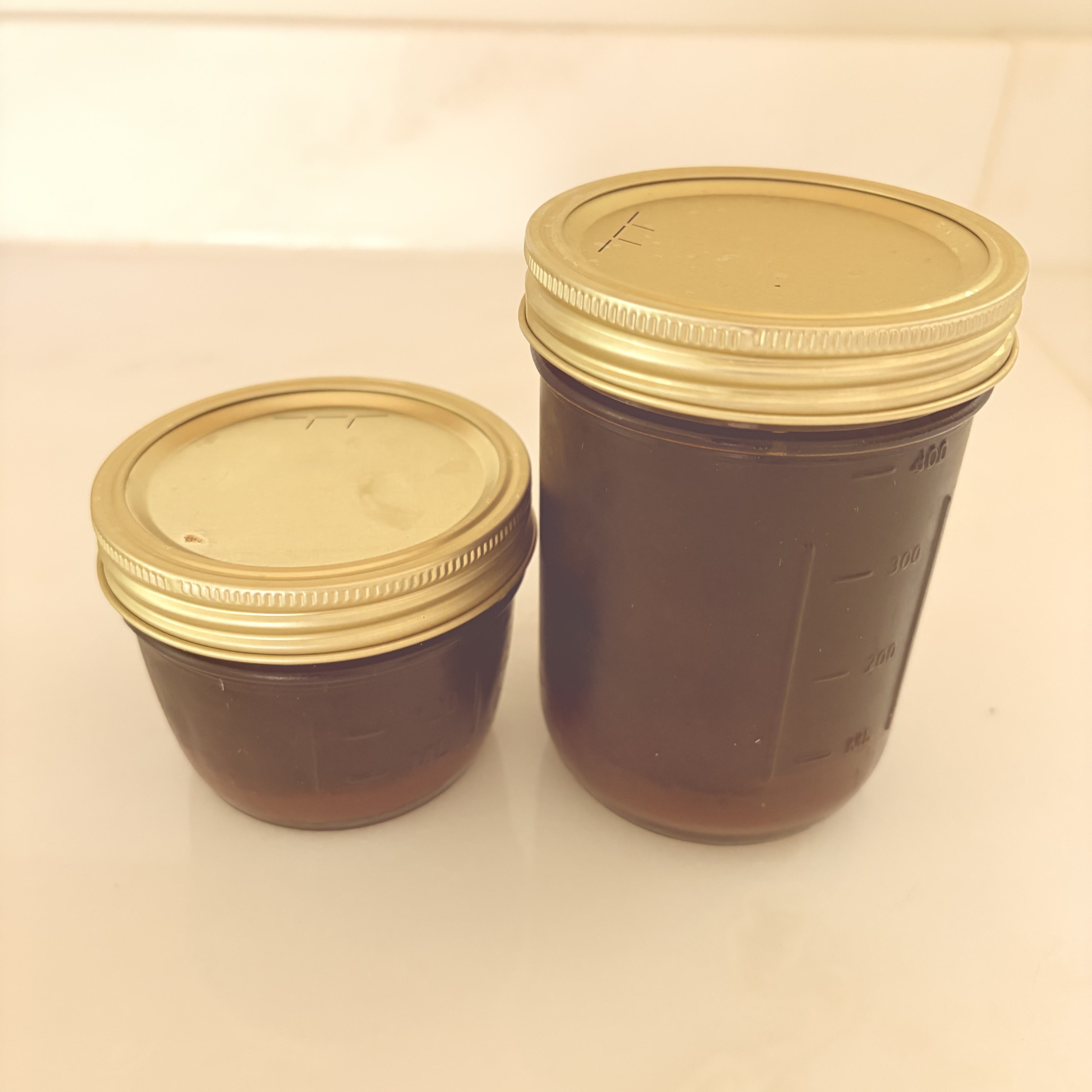 Elderberry syrup in two size jars