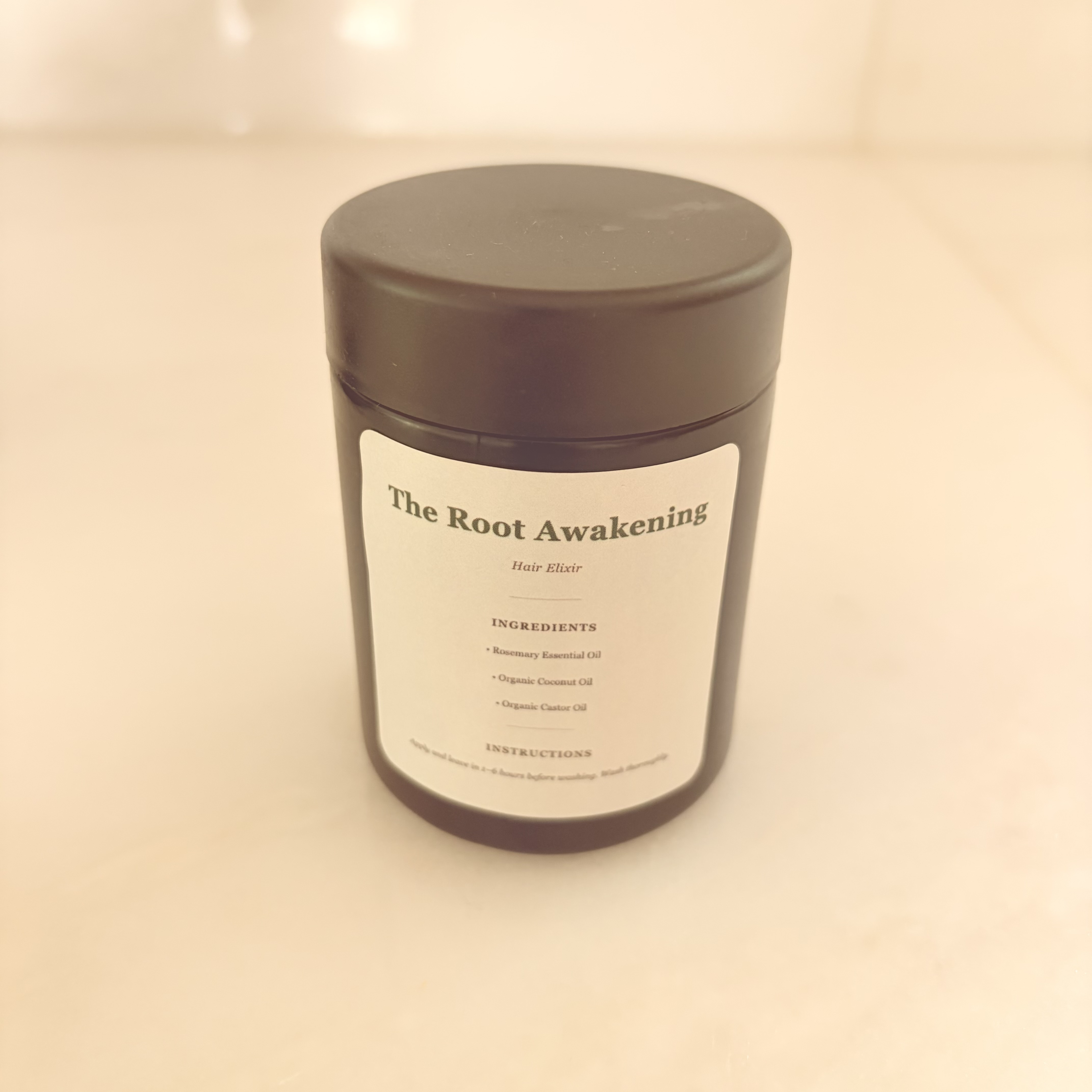 The Root Awakening Hair Elixir jar